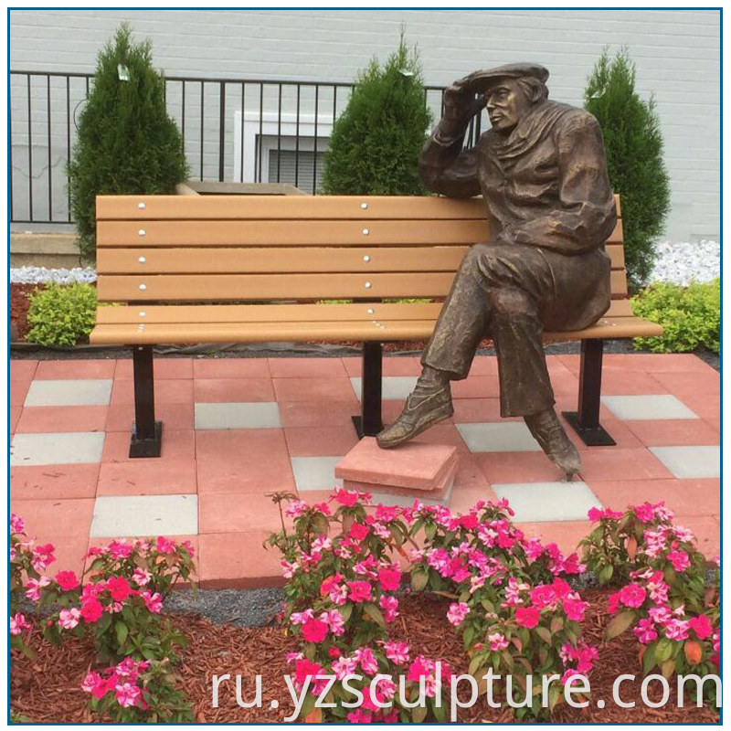 bronze sitting man sculpture